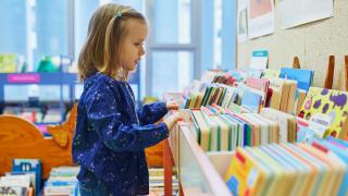 child looking at books