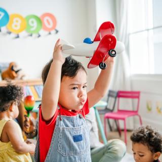 child playing in classroom