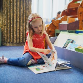 child reading book