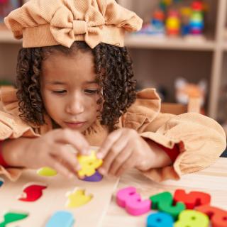 child playing with number blocks