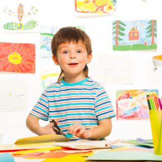 child cutting paper